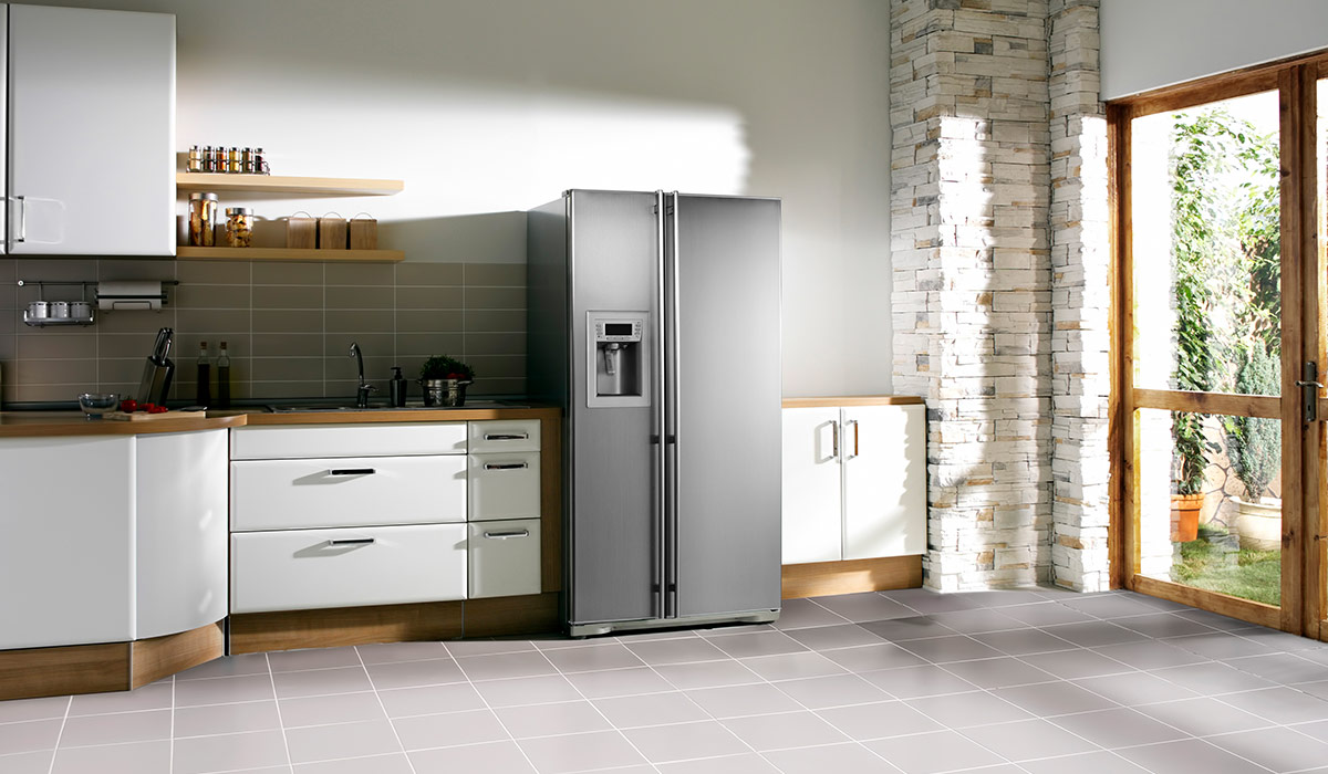 Stainless steel refrigerator in a modern kitchen.